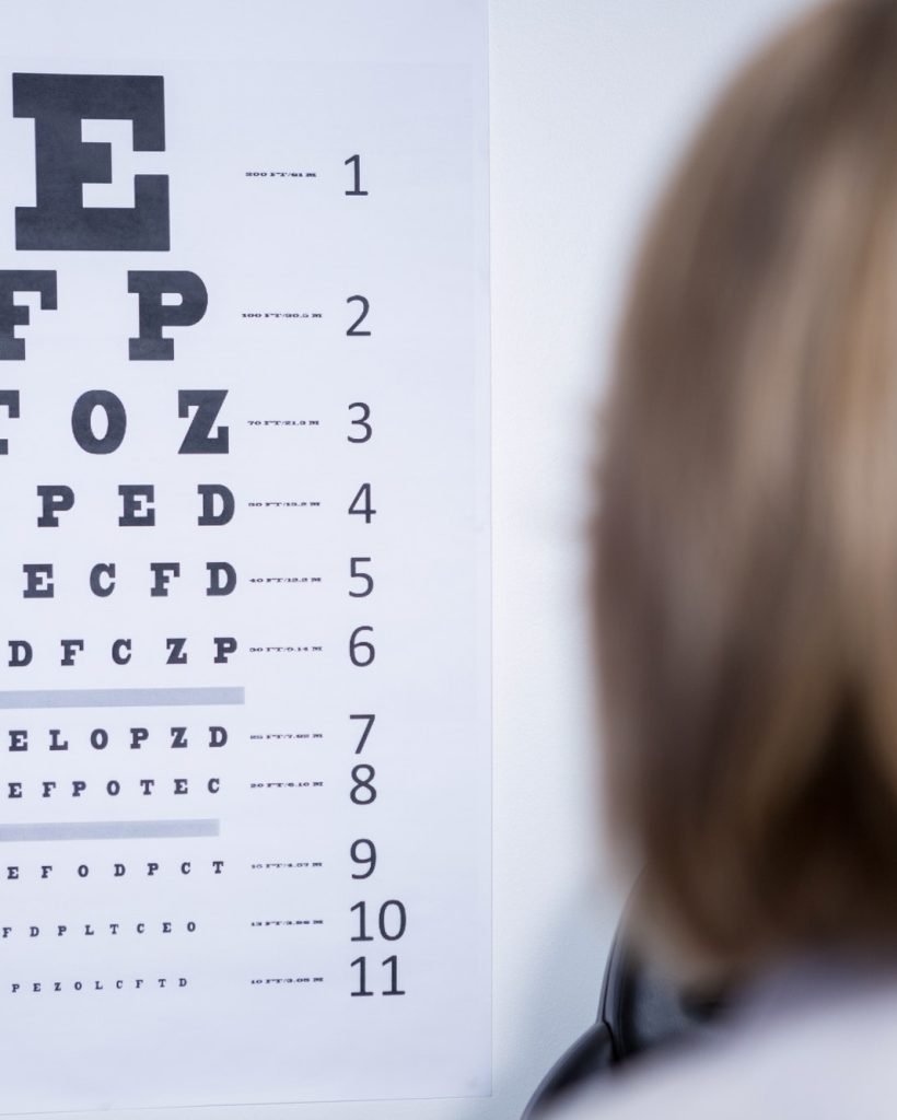 optometrist-looking-at-eye-chart.jpg