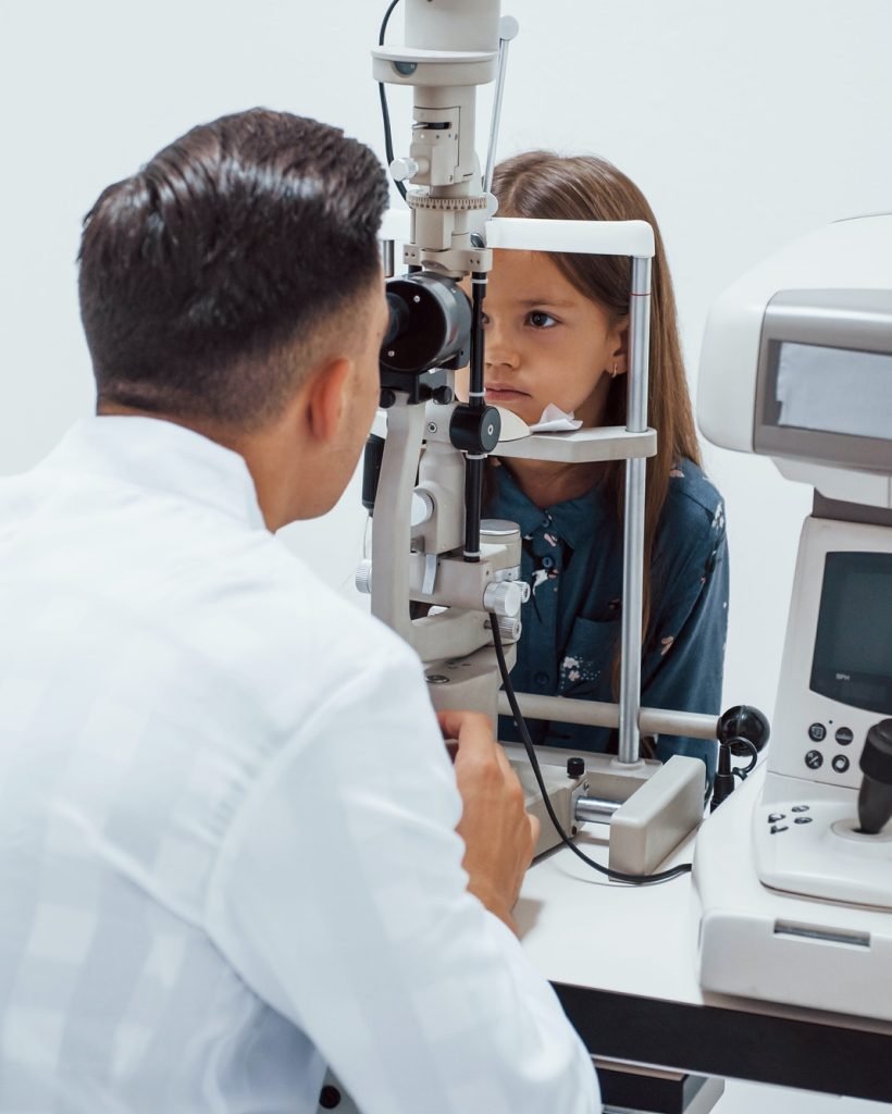 young-ophthalmologist-is-with-little-female-visitor-in-the-clinic.jpg